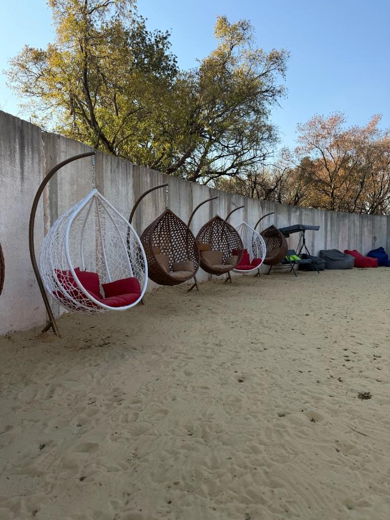 Hanging egg chairs in the lounge garden