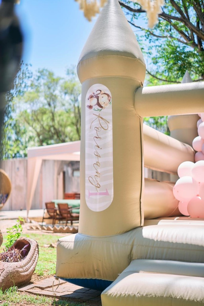 Themed jumping castle at a first birthday party